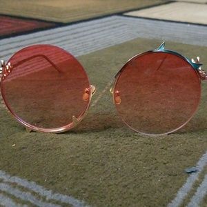 Pink tinted shades with spike detail.